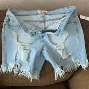 Light blue wash distressed jean shorts